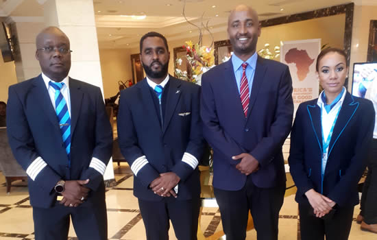 Dawit Lemma, Krimson MD (second from right), welcomes the crew of Bestfly, Krimson's 150th flight.