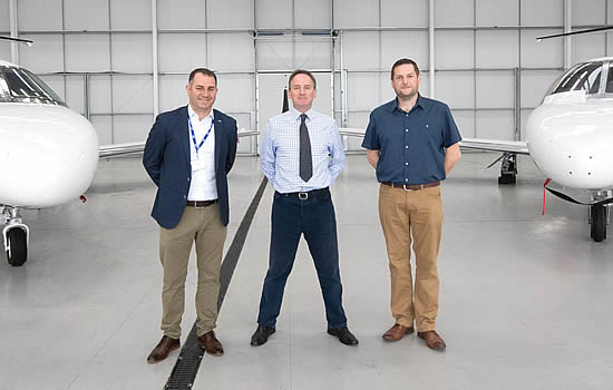In the Hangar at London Oxford Airport with Principals of JMI, (left) Ed Griffith and (right) Neil Plumb with Head of Business Development, London Oxford Airport, James Dillon-Godfray (centre).
