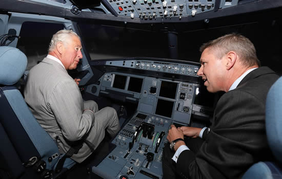 His Royal Highness The Prince of Wales on a A320 Reality Seven Full Flight Simulator with Robin Glover-Faure, President of L3Harris Commercial Training Solutions.