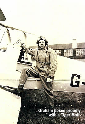 Graham poses proudly with a Tiger Moth.