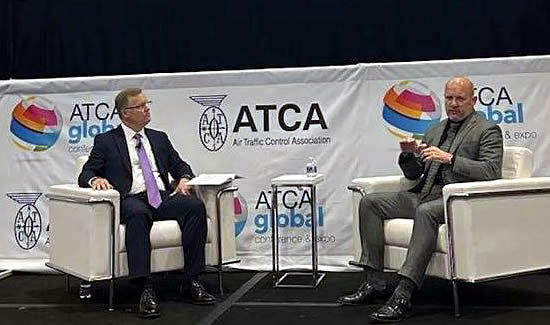 NBAA COO Chris Rocheleau (left) with guest, Tim Arel, at the ATCA's Global Conference and Expo in Washington, DC.