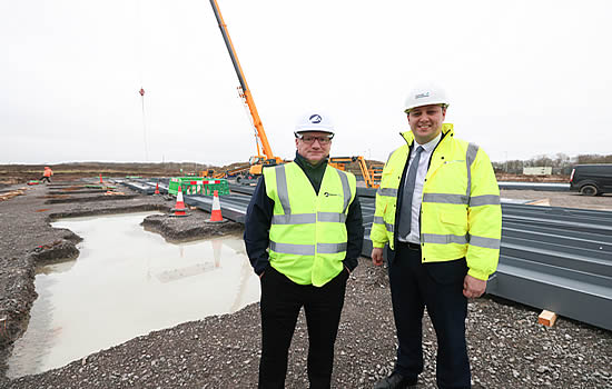 Steve Darbyshire, founder and Chief Executive of Airbourne Colours, with Tees Valley Mayor Ben Houchen at the new hangar under construction at Teesside Airport.