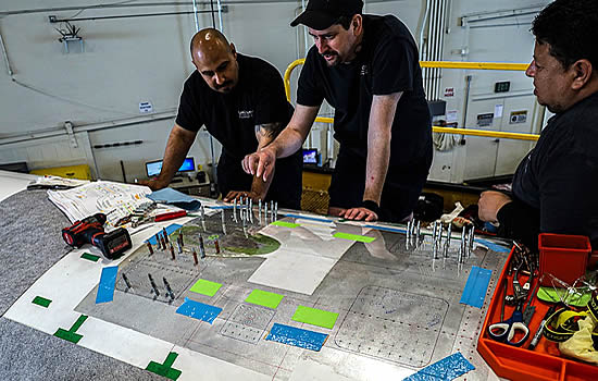 Clay Lacy Avionics Technicians preparing fuselage for Starlink Aero Terminal installation.