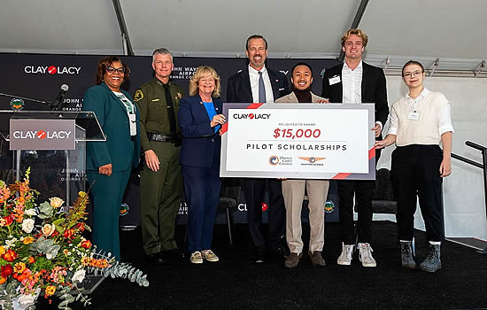 Presentation of annual scholarship to Orange Coast College School of Aviation Science with Head of Program, Stanley Harriman, and students.